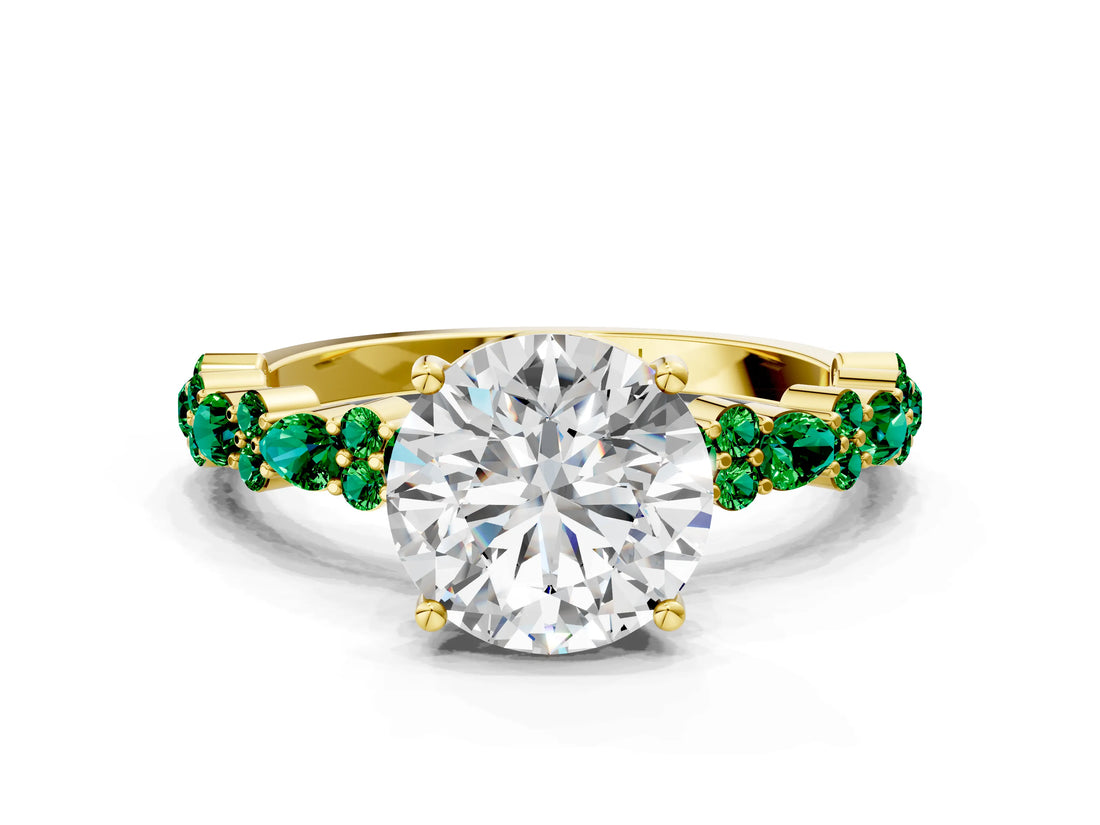 Yellow gold Round Cut Diamond Side Stone Solitaire Ring with Round with Emerald side stone and Four-Prong Setting
