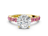 Yellow gold Round Cut Diamond Side Stone Solitaire Ring with Round with Pink Sapphire side stone and Four-Prong Setting