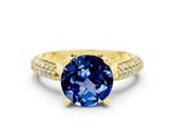 Yellow gold Round Cut Diamond Solitaire Engagement Ring with Pavé Band and Four-Prong Setting
