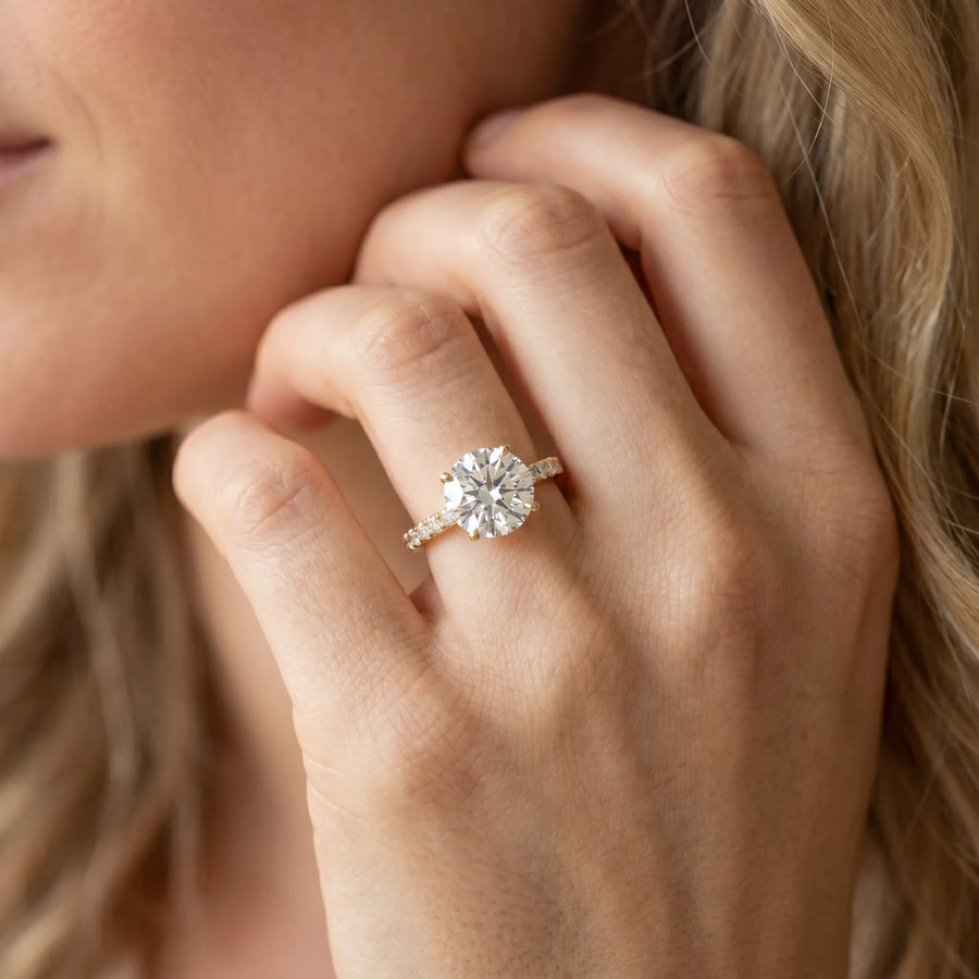 Yellow gold Round Cut Diamond Solitaire Engagement Ring with Round  Pavé Band and Prong Setting