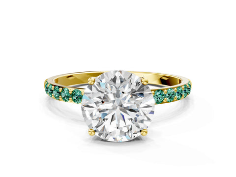 Yellow gold Round Cut Diamond Solitaire Engagement Ring with Round with Green Sapphire side stone Pavé Band and Prong Setting