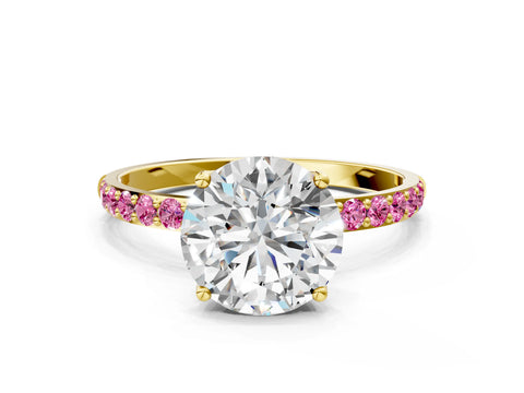Yellow gold Round Cut Diamond Solitaire Engagement Ring with Round with Pink Sapphire side stone Pavé Band and Prong Setting