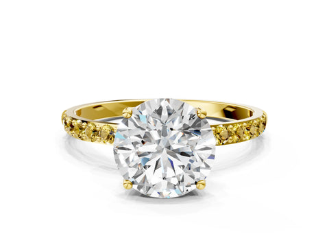 Yellow gold Round Cut Diamond Solitaire Engagement Ring with Round with Yellow Sapphire side stone Pavé Band and Prong Setting