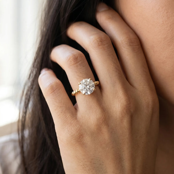 Yellow gold Round Cut Diamond Solitaire Ring with Beaded Band and Prong Setting