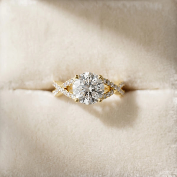 Yellow gold Round Cut Diamond Solitaire Ring with Four-Prong Setting and Twisted Pavé Band