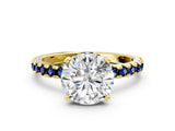 Yellow gold Round Cut Diamond Solitaire Ring with Round with Blue Sapphire side stone Pavé Band and Four-Prong Setting_36