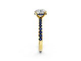 Yellow gold Round Cut Diamond Solitaire Ring with Round with Blue Sapphire side stone Pavé Band and Four-Prong Setting_38