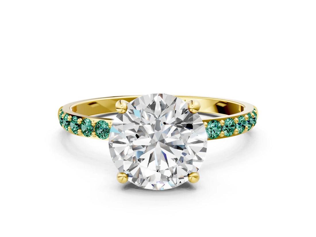 Yellow gold Round Cut Diamond Solitaire Ring with Round with Green Sapphire side stone Pavé Band and Prong Setting