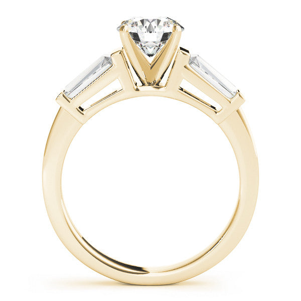 Yellow gold Round Cut Diamond Solitaire Ring with Tapered Baguette Accents and Four-Prong Setting 1