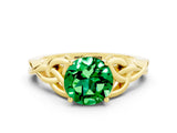 Yellow gold Round Cut Emerald Solitaire Engagement Ring with Celtic Knot Band and Four-Prong Setting