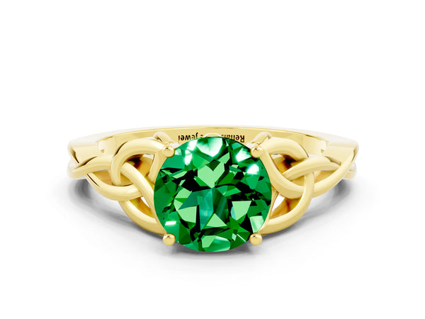 Yellow gold Round Cut Emerald Solitaire Engagement Ring with Celtic Knot Band and Four-Prong Setting