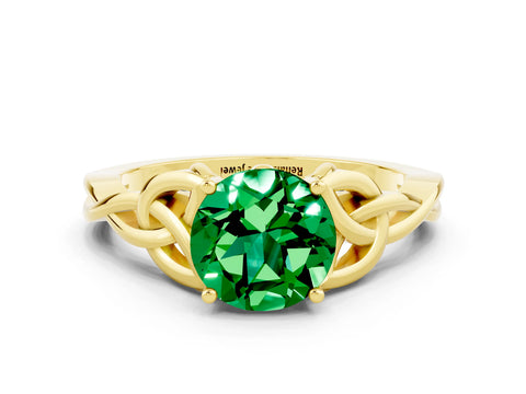 Yellow gold Round Cut Emerald Solitaire Engagement Ring with Celtic Knot Band and Four-Prong Setting