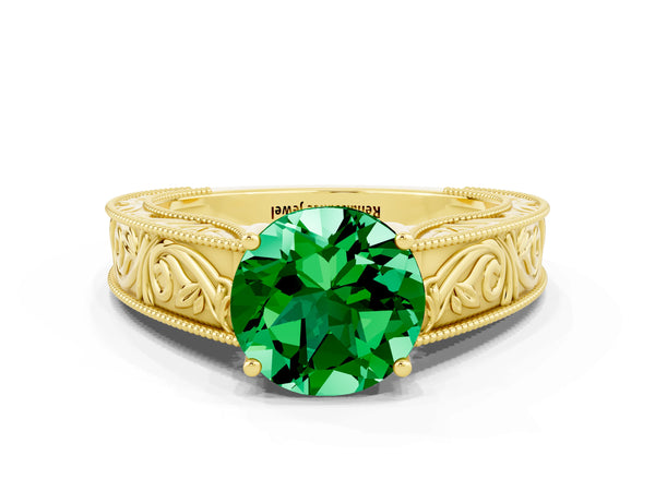 Yellow gold Round Cut Emerald Solitaire Ring with Engraved Band and Four-Prong Setting