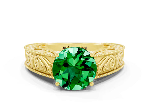 Yellow gold Round Cut Emerald Solitaire Ring with Engraved Band and Four-Prong Setting