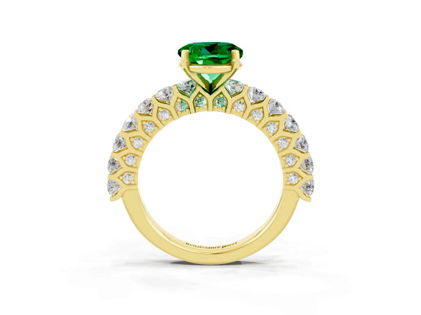 Yellow gold Round Cut Emerald Solitaire Ring with Shared Prong Pavé Band and Four-Prong Setting