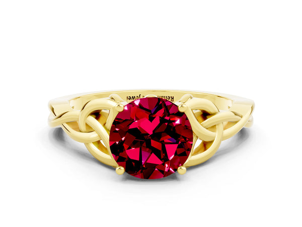 Yellow gold Round Cut Garnet Solitaire Engagement Ring with Celtic Knot Band and Four-Prong Setting