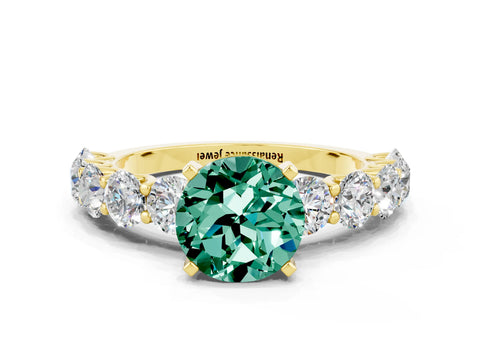 Yellow gold Round Cut Green Sapphire Prong Setting with Side Stones on a Pave Band