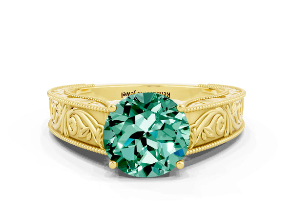 Yellow gold Round Cut Green Sapphire Solitaire Ring with Engraved Band and Four-Prong Setting