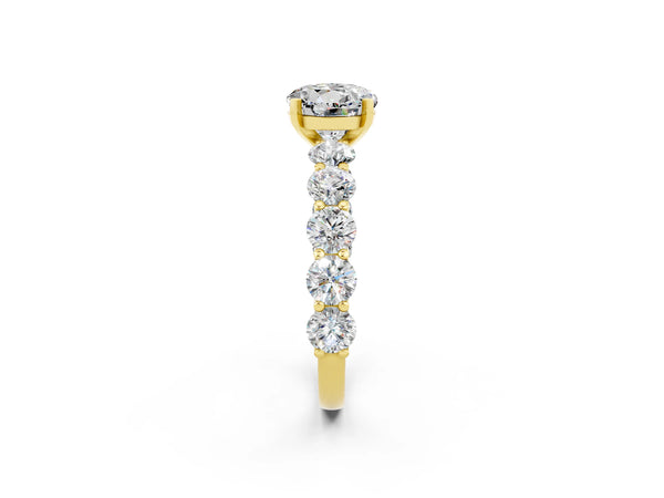 Yellow gold Round Cut Moissanite Prong Setting with Side Stones on a Pave Band