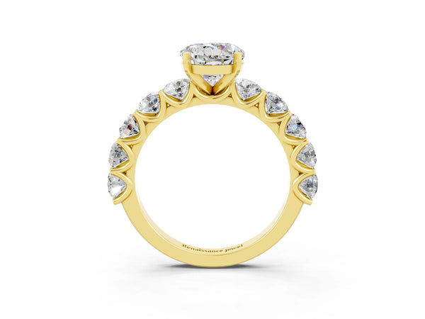 Yellow gold Round Cut Moissanite Prong Setting with Side Stones on a Pave Band