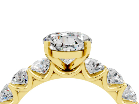 Yellow gold Round Cut Moissanite Prong Setting with Side Stones on a Pave Band_4