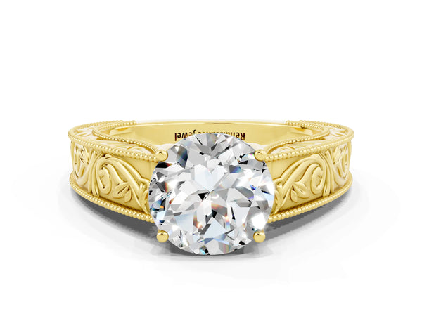 Yellow gold Round Cut Moissanite Solitaire Ring with Engraved Band and Four-Prong Setting
