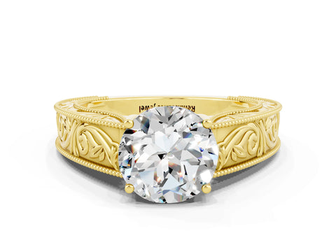 Yellow gold Round Cut Moissanite Solitaire Ring with Engraved Band and Four-Prong Setting