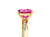 Yellow gold Round Cut Pink Sapphire Engagement Ring with Side Stone Accents and Four-Prong Setting_56