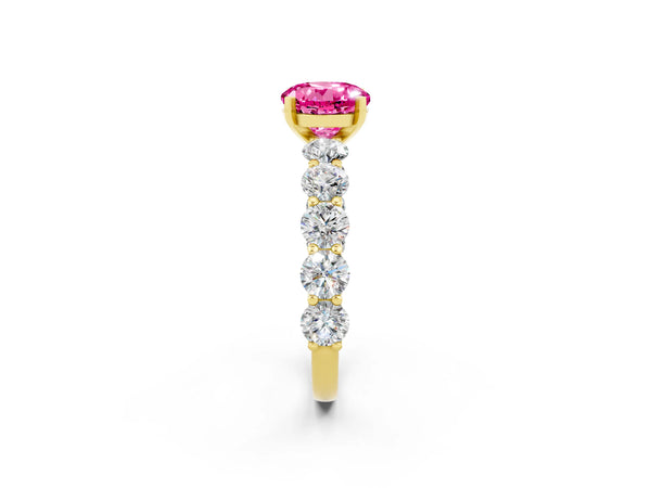 Yellow gold Round Cut Pink Sapphire Prong Setting with Side Stones on a Pave Band