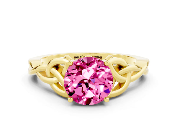 Yellow gold Round Cut Pink Sapphire Solitaire Engagement Ring with Celtic Knot Band and Four-Prong Setting