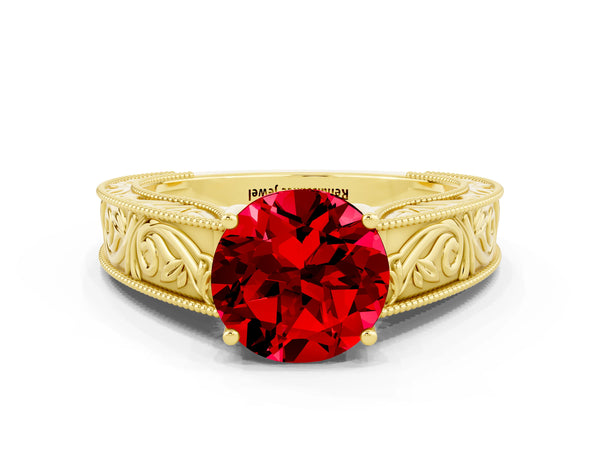 Yellow gold Round Cut Ruby Solitaire Ring with Engraved Band and Four-Prong Setting