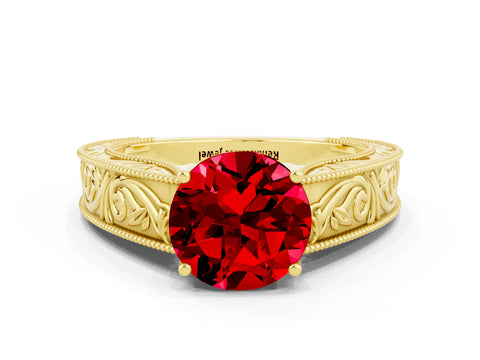 Yellow gold Round Cut Ruby Solitaire Ring with Engraved Band and Four-Prong Setting