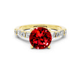 Yellow gold Round Cut Ruby Solitaire with Side Baguettes and Channel Set Band