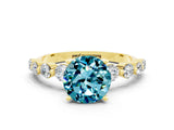 Yellow gold Round Cut Solitaire Blue Topaz Ring with Pave Band and Four-Prong Setting