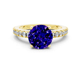 Yellow gold Round Cut Solitaire Diamond with Pavé Band and Four-Prong Setting
