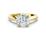 Yellow gold Round Cut Solitaire Engagement Ring with Tapered Band and Four-Prong Setting