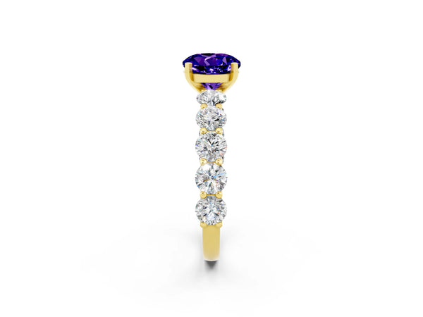 Yellow gold Round Cut Tanzanite Prong Setting with Side Stones on a Pave Band
