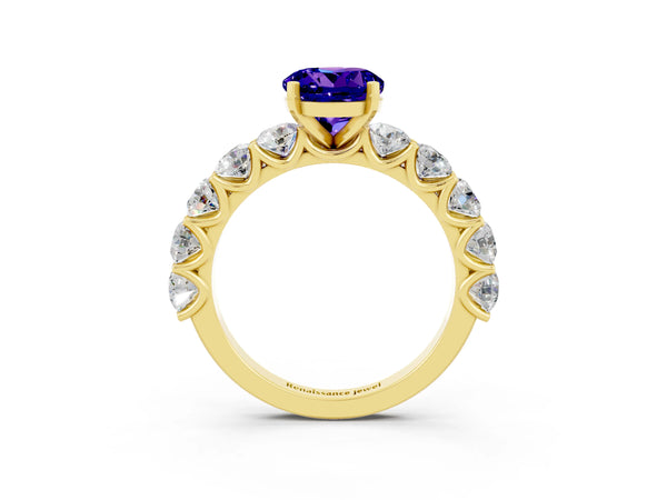 Yellow gold Round Cut Tanzanite Prong Setting with Side Stones on a Pave Band