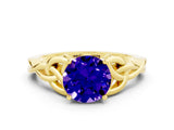 Yellow gold Round Cut Tanzanite Solitaire Engagement Ring with Celtic Knot Band and Four-Prong Setting