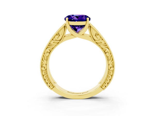 Yellow gold Round Cut Tanzanite Solitaire Ring with Engraved Band and Four-Prong Setting