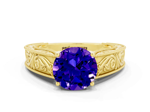 Yellow gold Round Cut Tanzanite Solitaire Ring with Engraved Band and Four-Prong Setting