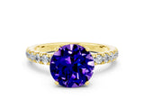 Yellow gold Round Cut Tanzanite Solitaire Ring with Pavé Accents and Four-Prong Setting