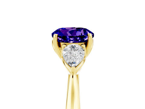 Yellow gold Round Cut Tanzanite Three-Stone Ring with Pear Side Stones and Four-Prong Setting_17