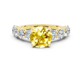 Yellow gold Round Cut Yellow Sapphire Prong Setting with Side Stones on a Pave Band_24