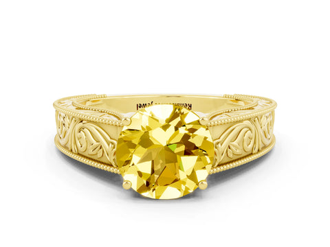 Yellow gold Round Cut Yellow Sapphire Solitaire Ring with Engraved Band and Four-Prong Setting