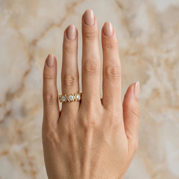 Yellow gold Round Diamond Channel Set Band with X-Prong Detail