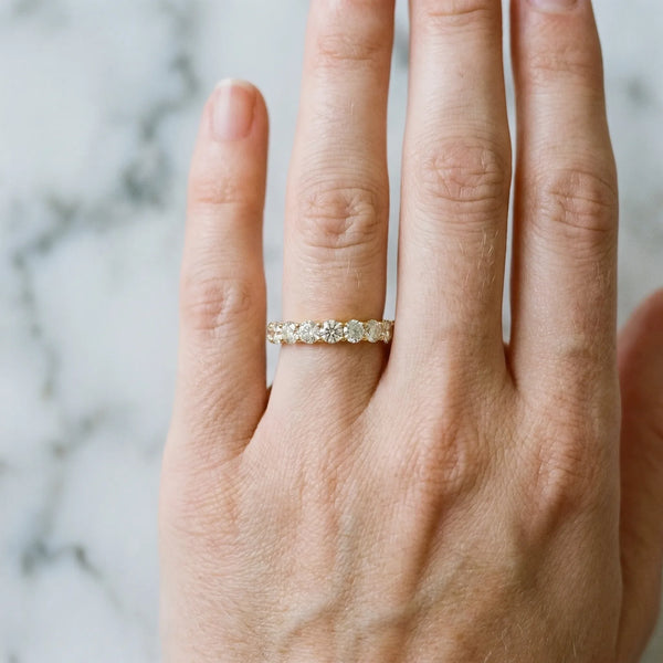 10K Yellow Gold Round Diamond Eternity Band with Pavé Setting and Shared Prong