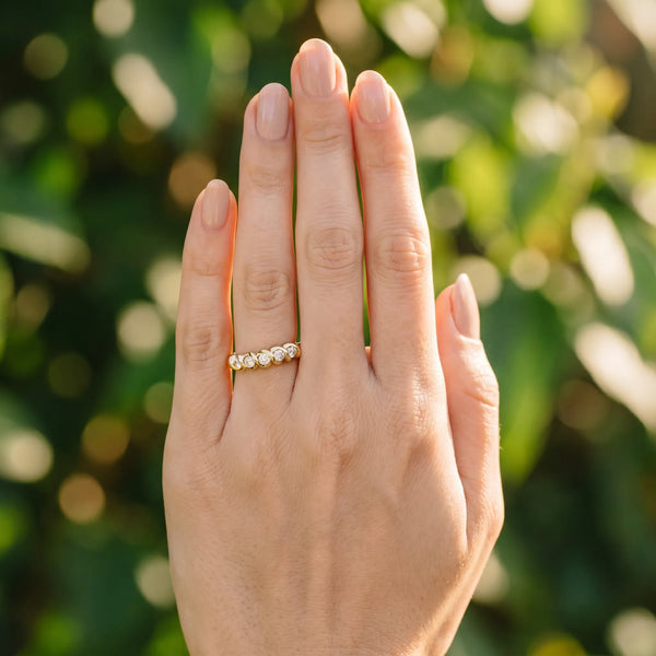 Yellow gold Round Diamond Eternity Band with Twist Prong Setting