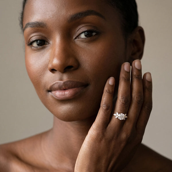 Yellow gold Round Diamond Floral Cluster Ring with Marquise Side Stones and Six-Prong Solitaire Setting