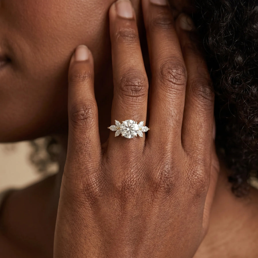 Yellow gold Round Diamond Floral Cluster Ring with Marquise Side Stones and Six-Prong Solitaire Setting